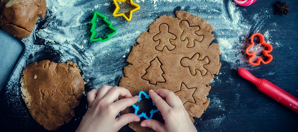 Child making Christmas cookies